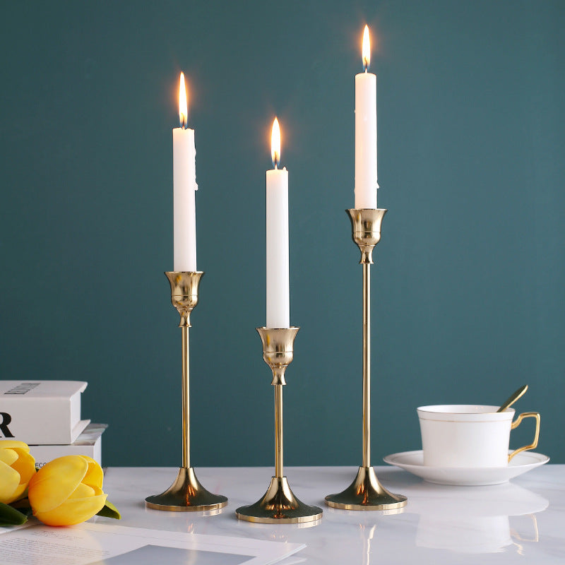 VibeCore Vintage Golden Candle Holder, crafted from high-quality iron and brass, featuring a sleek golden finish that adds European charm and elegance to any room, perfect for creating a romantic ambiance.