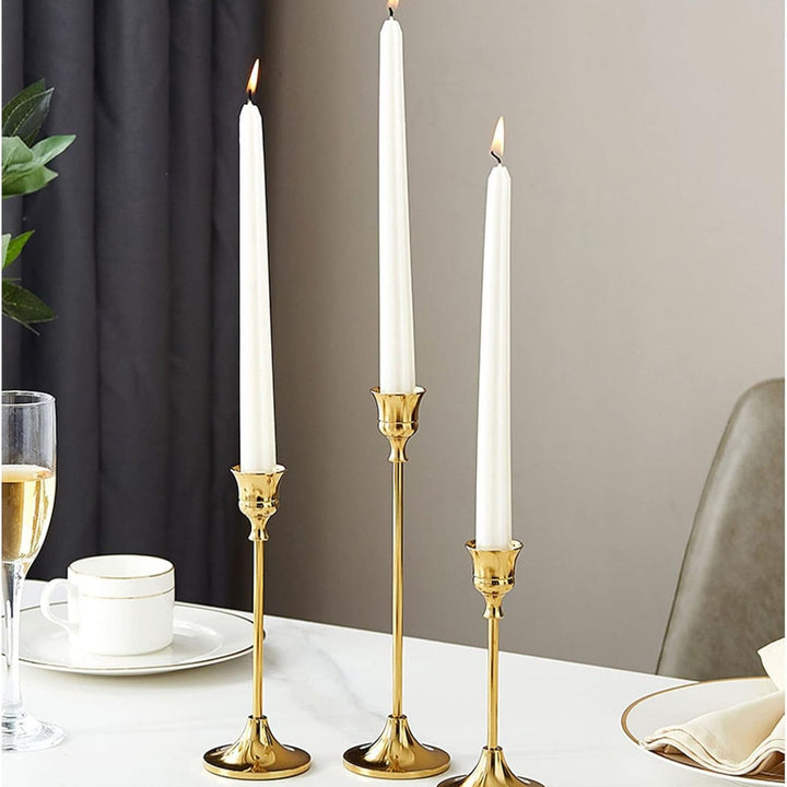 VibeCore Vintage Golden Candle Holder, all 3 sizes on dining table, crafted from high-quality iron and brass with a sleek golden finish, adding a touch of European elegance and sophistication to your dining space.