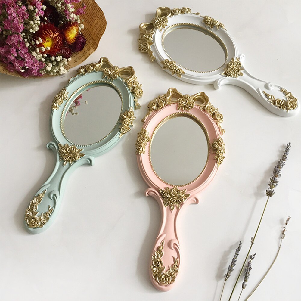 VibeCore Vintage Princess Hand Mirror in pastel green, light pink, and white, showcasing their elegant, rose-patterned handles and timeless European-inspired design.