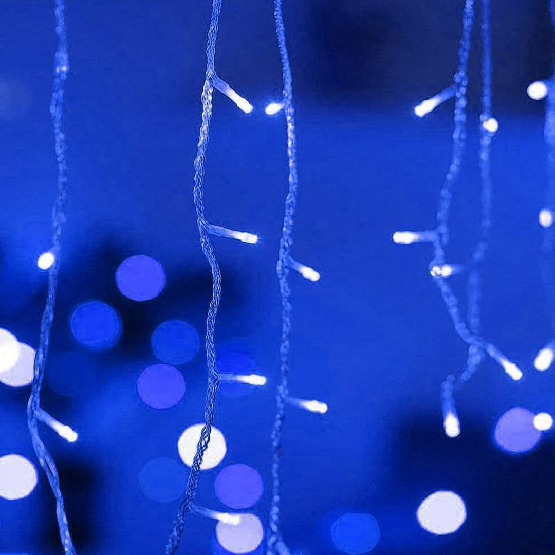 Close-up of VibeCore waterfall string lights in blue, glowing with a soft, calming light for a serene, cozy ambiance.