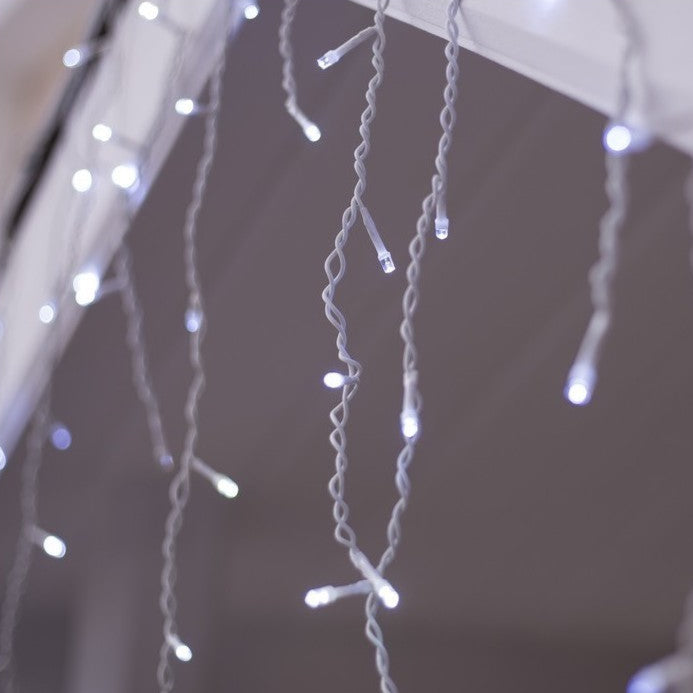 VibeCore waterfall string lights in white, creating a crisp, elegant glow to brighten any space with a fresh and vibrant atmosphere.