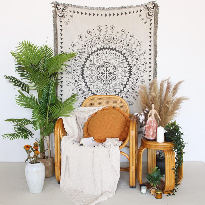 VibeCore White Boho Mandala Woven Blanket as wall hanging, showcasing a calming boho mandala design. Made from soft, breathable 100% combed cotton, it adds a vibrant, artistic touch and bohemian charm to any room.
