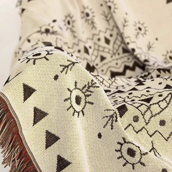 VibeCore White Boho Mandala Woven Blanket material close-up, highlighting the soft, breathable 100% combed cotton. Showcasing the intricate boho mandala design and high-quality weave for ultimate comfort and lasting style.