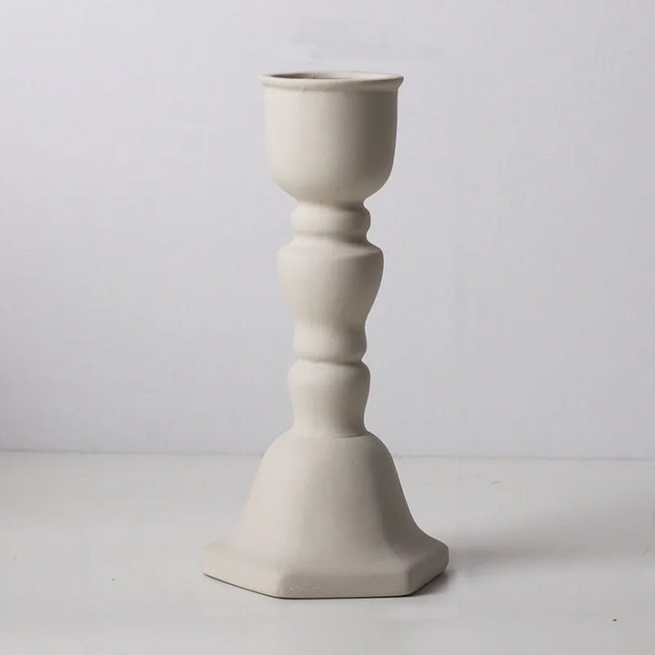 Featuring a sleek and modern design, this ceramic candle holder brings a stylish yet simple touch to your space. Its clean lines and high-quality ceramic build make it a versatile addition to any room's decor.