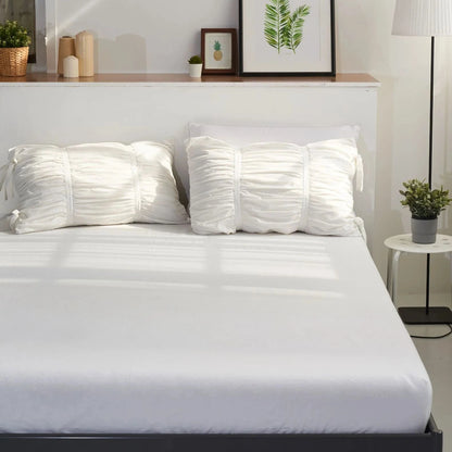 VibeCore white ruched pillowcases on bed, tufted cotton design, part of fleece duvet_cover set, soft breathable fabric, aesthetic coquette decor, elegant white bedding, romantic minimalist style, timeless cotton texture, cozy bedroom detail, twin or king size pillow styling.