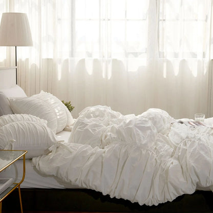 Side view of VibeCore white ruched duvet cover set on bed, aesthetic tufted cotton bedding, soft fleece duvet_cover set, breathable fabric, elegant white room decor, coquette bedroom vibe, romantic minimalist style, timeless bedding design, cozy cotton texture, twin or king size.