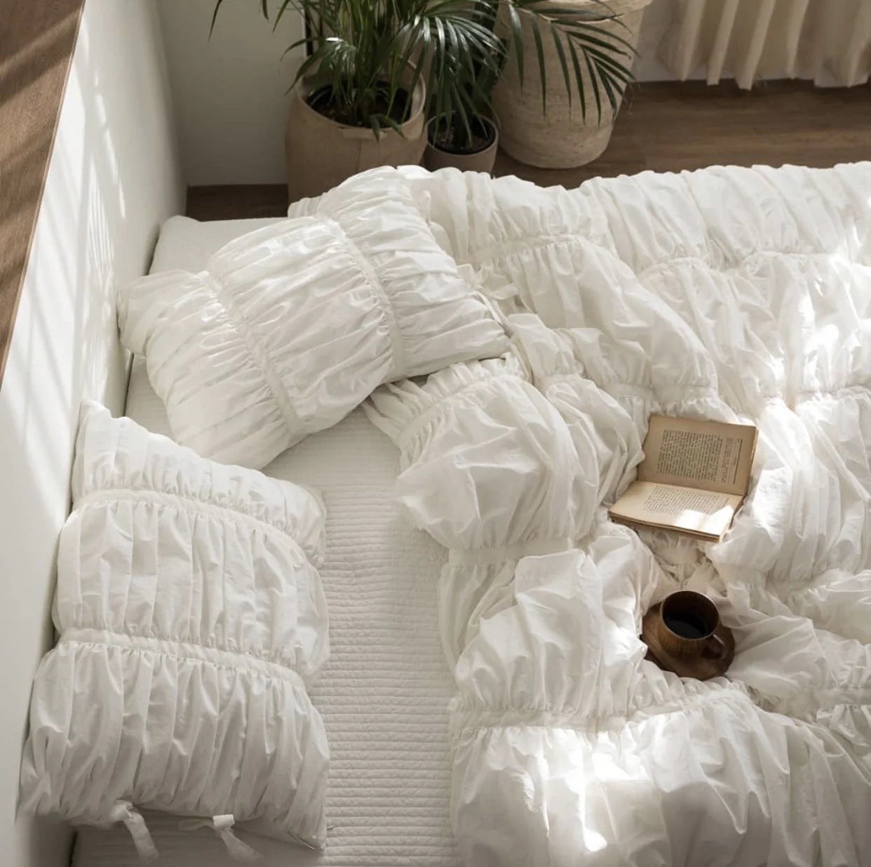 Top view of white ruched duvet cover set on bed, VibeCore aesthetic cotton bedding with tufted details, soft breathable fabric, romantic coquette decor, minimalist white bedroom, fleece duvet_cover set, elegant timeless design, king or twin bed styling, cozy luxury bedding idea.
