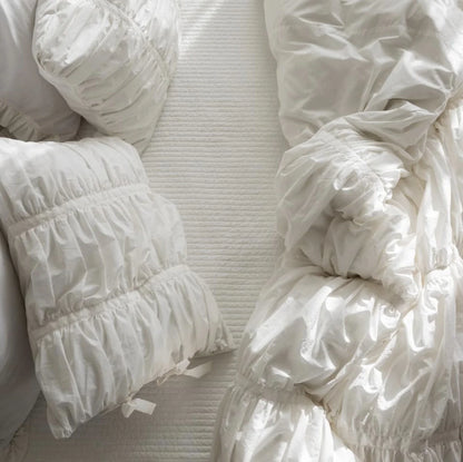 Close-up top view of VibeCore white ruched duvet cover set, textured tufted cotton fabric, aesthetic fleece duvet_cover set, soft breathable bedding, romantic coquette style, minimalist white decor, elegant luxury details, cozy bed inspiration, timeless cotton bedding, king or twin size.