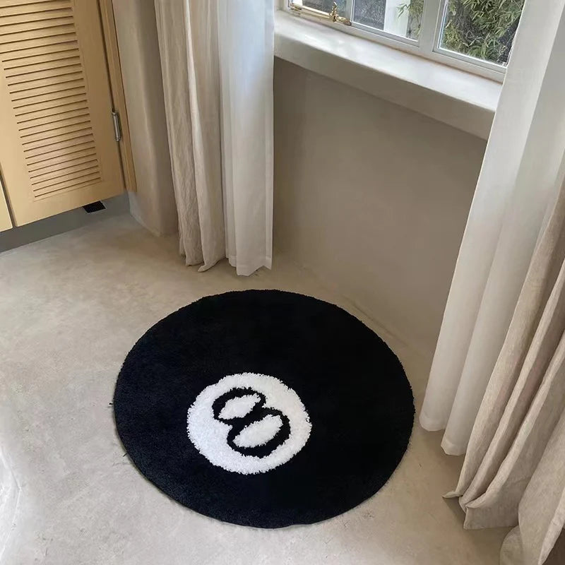 Aerial view of the VibeCore Lucky 8 Ball Rug, showcasing its black and white billiard ball design. Perfect for adding an aesthetic, contemporary touch to any floor, whether it be in a bedroom, living room, dorm or bathroom. 
