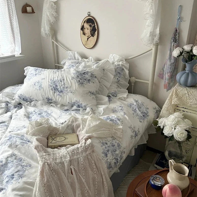 Vintage-style bedroom with floral bedding and decorative items.