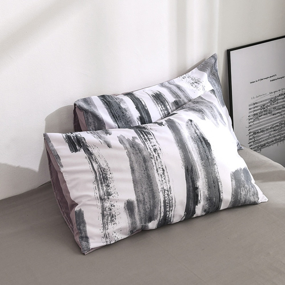 Close-up of the VibeCore Aesthetic Abstract Canvas Duvet Cover Set pillowcases, featuring the bold abstract canvas design. Made from a soft cotton-polyester blend, these pillowcases offer a cozy and stylish addition to your bedroom or dorm, perfectly complementing the duvet cover.