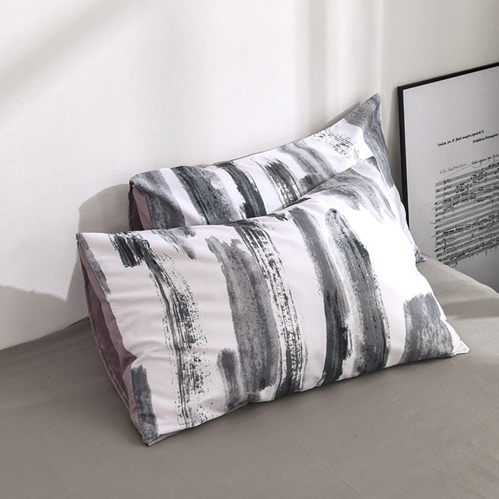 Close-up of the VibeCore Aesthetic Abstract Canvas Duvet Cover Set pillowcases, featuring the bold abstract canvas design. Made from a soft cotton-polyester blend, these pillowcases offer a cozy and stylish addition to your bedroom or dorm, perfectly complementing the duvet cover.