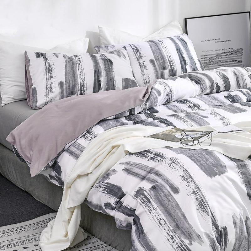 Side front view of the VibeCore Aesthetic Abstract Canvas Duvet Cover Set, featuring a striking abstract canvas design. The bold, artistic pattern brings a creative touch to your bedroom or dorm, while the durable cotton-polyester blend ensures year-round comfort and style.