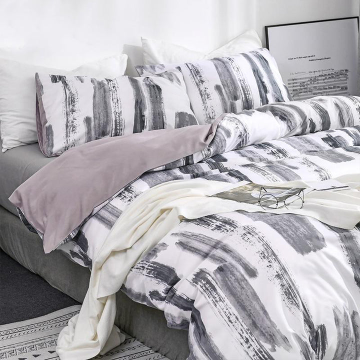 Side front view of the VibeCore Aesthetic Abstract Canvas Duvet Cover Set, featuring a striking abstract canvas design. The bold, artistic pattern brings a creative touch to your bedroom or dorm, while the durable cotton-polyester blend ensures year-round comfort and style.