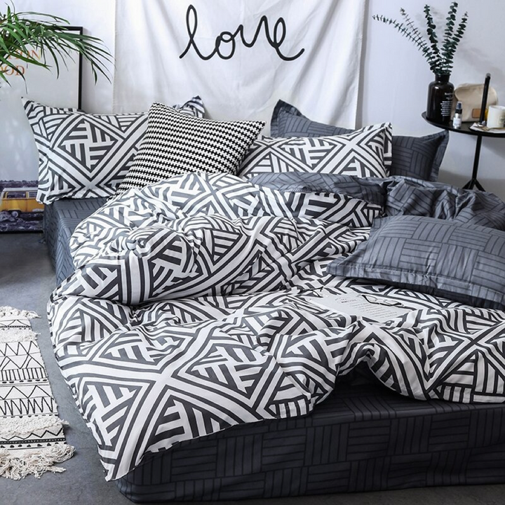 Front view of the VibeCore Aesthetic Aztec Geometric Duvet Cover Set in black and white, featuring bold Aztec-inspired geometric patterns. Crafted from a soft cotton-polyester blend, this duvet cover set brings modern elegance and comfort to any bedroom or dorm room.