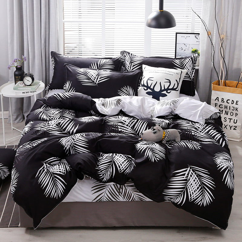 Aerial view of the VibeCore Aesthetic Black Leaf Duvet Cover Set, featuring a stylish black and green leaf pattern. Made from a soft cotton-polyester blend, this duvet cover set adds a touch of nature-inspired elegance and comfort to modern bedrooms or dorm rooms.