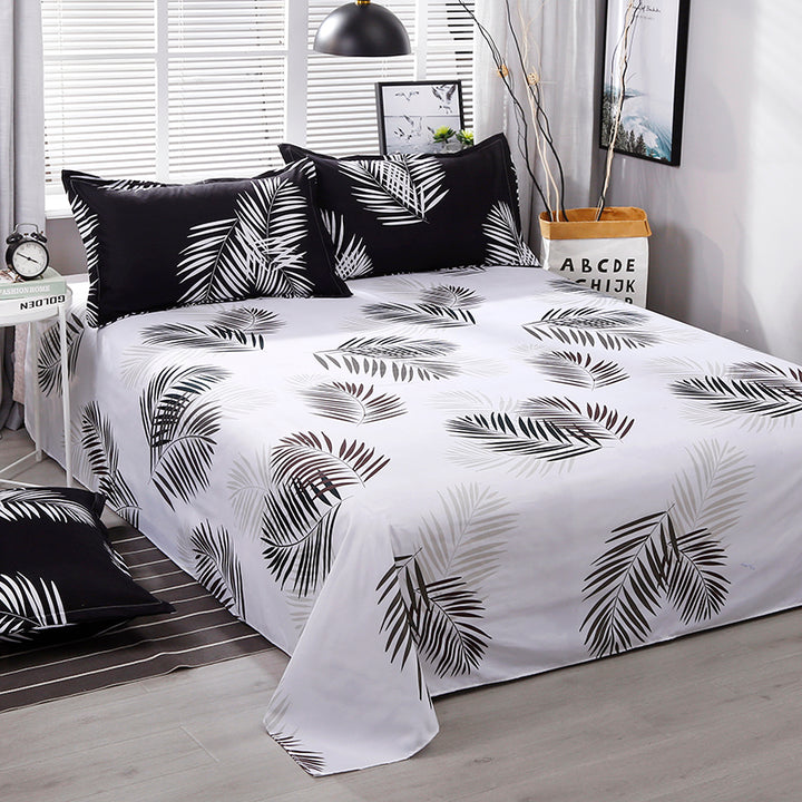 Close-up of the white sheet from the VibeCore Aesthetic Black Leaf Duvet Cover Set, offering a clean and crisp contrast to the bold black and green leaf pattern. Made from a soft cotton-polyester blend, this sheet adds comfort and complements the nature-inspired bedding design.