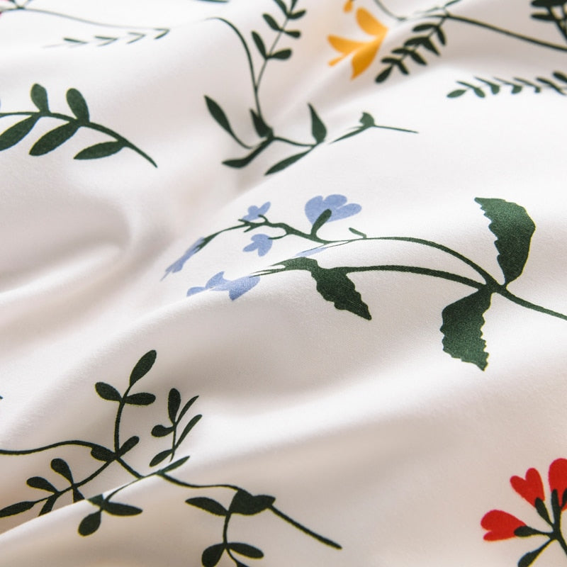 Close-up of the vibrant floral pattern on the VibeCore Aesthetic Colorful Flower Duvet Cover Set, featuring bold colors and nature-inspired design. Made from a soft cotton-polyester blend, this pattern adds a cheerful, lively touch to any bedroom or dorm room.