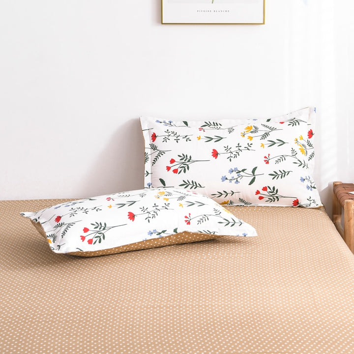 Close-up of the VibeCore Aesthetic Colorful Flower Pillowcases, featuring vibrant floral patterns in bold, cheerful colors. Made from a soft cotton-polyester blend, these pillowcases add comfort and style, perfectly complementing the colorful duvet cover set.