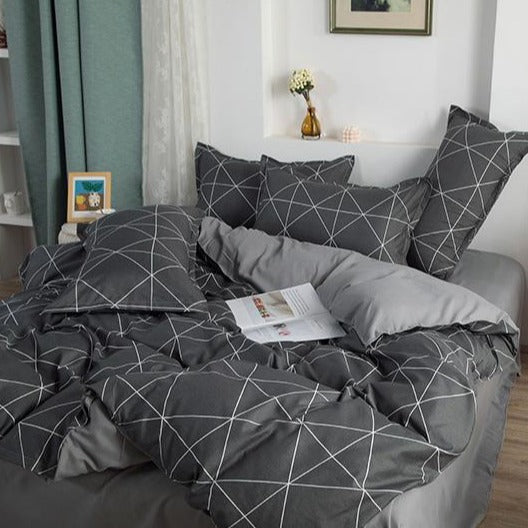 Angled view of VibeCore Aesthetic Gray Geometric Duvet Cover Set, highlighting modern geometric patterns in gray tones. Crafted from a soft cotton-polyester blend, this bedding set brings contemporary style and comfort to any bedroom or dorm room.