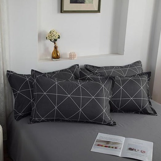 Close-up of the VibeCore Aesthetic Gray Geometric Pillowcases featuring modern geometric patterns in gray tones. Crafted from a soft cotton-polyester blend, these pillowcases offer both style and comfort, perfectly complementing the geometric duvet cover set.