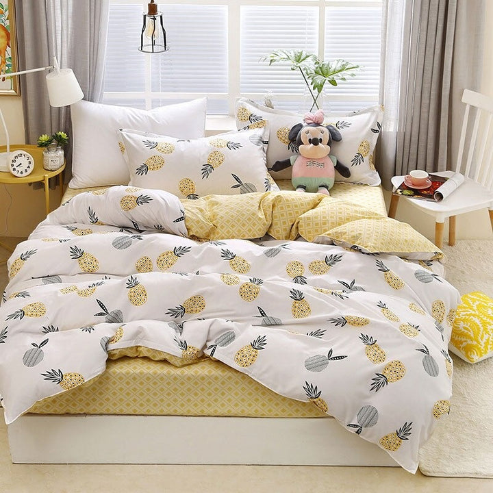 Aerial view of the VibeCore Aesthetic Pineapple Duvet Cover Set, showcasing its playful and vibrant pineapple pattern. The durable cotton-polyester blend offers year-round comfort, making this bedding set a stylish and cozy addition to any bedroom or dorm with a tropical touch.