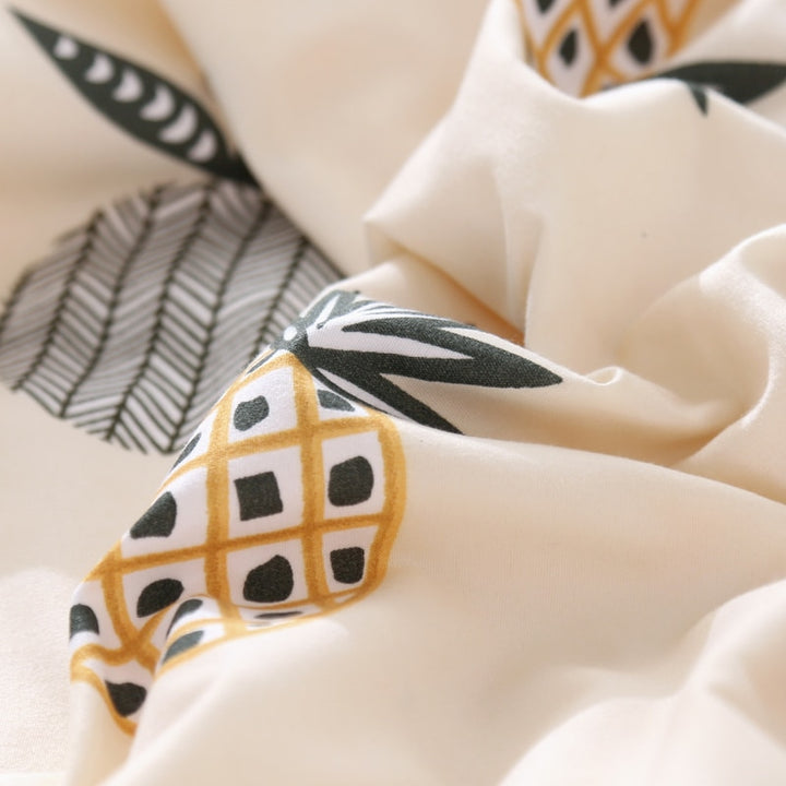 Close-up of the fabric material of the VibeCore Aesthetic Pineapple Duvet Cover Set, made from a durable and soft cotton-polyester blend. This material provides year-round comfort, ensuring a cozy feel while maintaining the vibrant pineapple design.