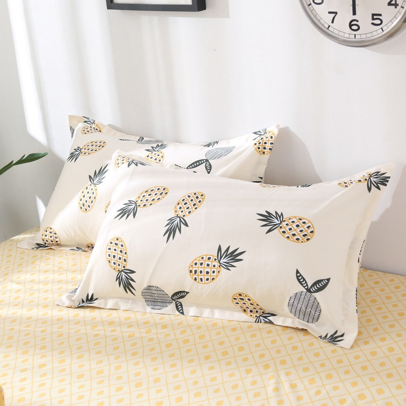 Close-up of the VibeCore Aesthetic Pineapple Duvet Cover Set pillowcases, featuring the playful tropical pineapple design. Crafted from a soft cotton-polyester blend, these pillowcases add a cozy and vibrant touch to your bedroom or dorm while complementing the duvet cover.