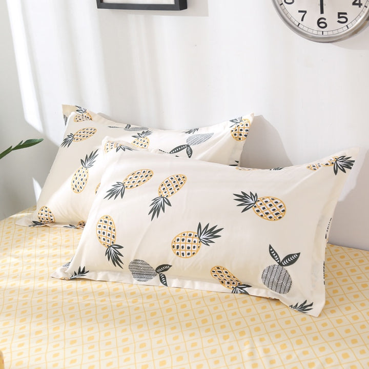 Close-up of the VibeCore Aesthetic Pineapple Duvet Cover Set pillowcases, featuring the playful tropical pineapple design. Crafted from a soft cotton-polyester blend, these pillowcases add a cozy and vibrant touch to your bedroom or dorm while complementing the duvet cover.