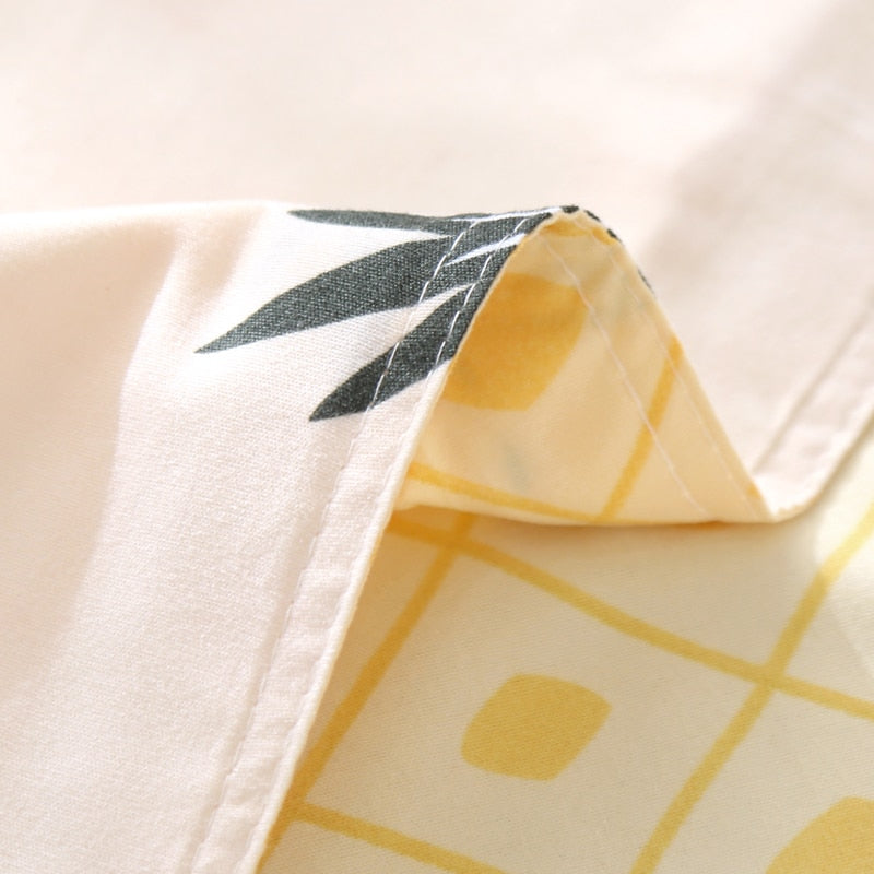 Close-up of the stitching detail on the VibeCore Aesthetic Pineapple Duvet Cover Set, showcasing the clean and durable craftsmanship. The high-quality stitching ensures long-lasting use while maintaining the vibrant tropical pineapple design.
