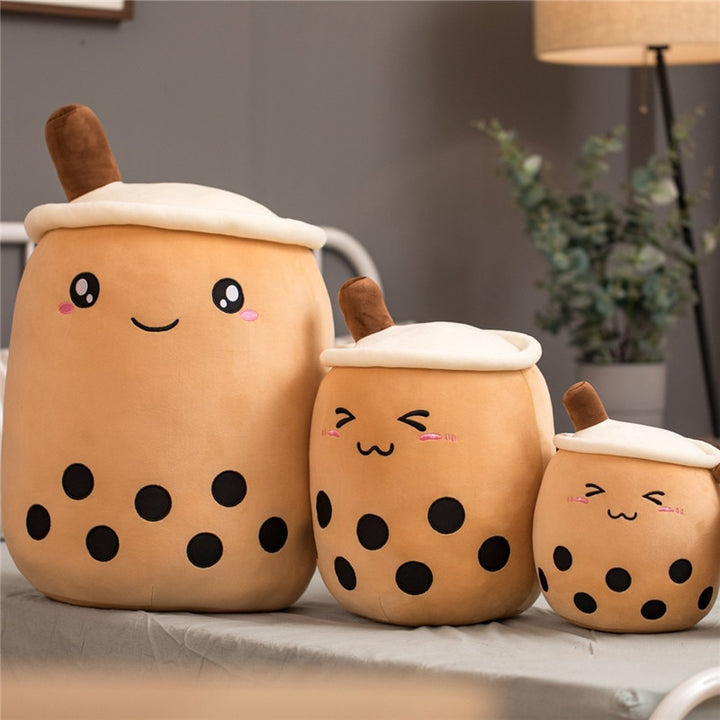 VibeCore Bubble Tea Stuffy plush pillow featuring a playful cartoon smiley face and fun boba design, available in three sizes, perfect for adding a kawaii touch to any room.