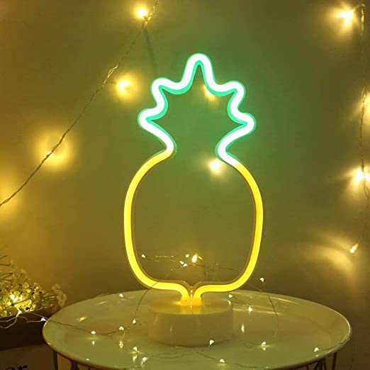 VibeCore Pineapple Neon Table Light With String Lights Behind It