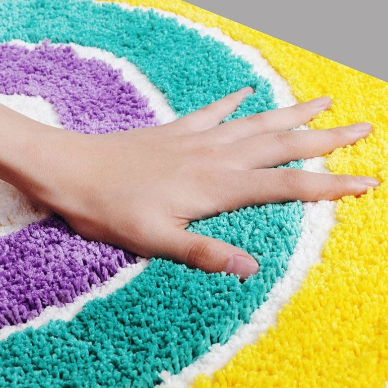 VibeCore Rainbow Plush Rug with a soft, fluffy feel, designed to provide ultimate comfort underfoot. Its plush texture makes it perfect for adding a cozy touch to any room while maintaining a vibrant, stylish look.