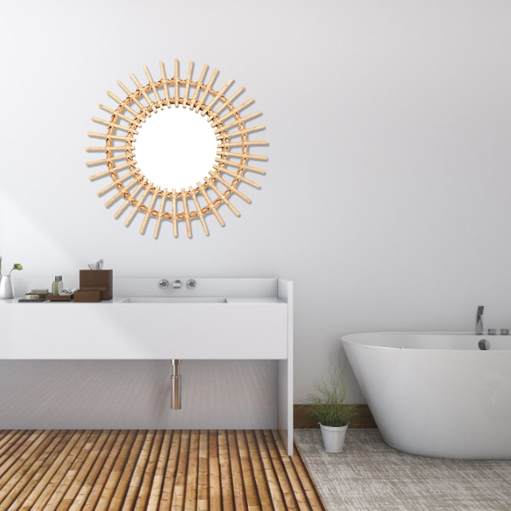 VibeCore Rattan Sun Mirror mounted on a bathroom wall, reflecting light and adding a natural, boho touch with its handcrafted rattan frame, enhancing the space's ambiance.